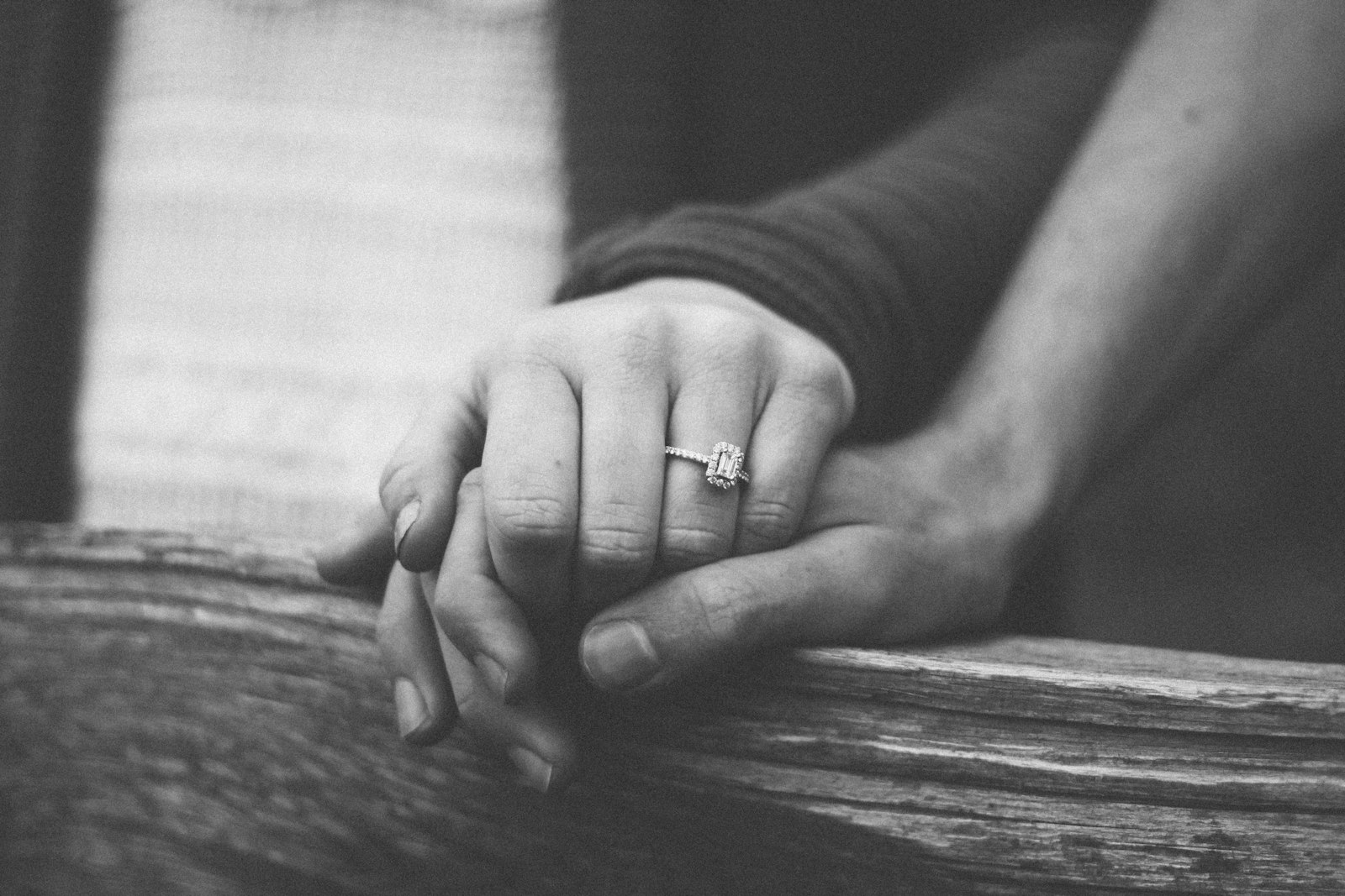Two hands clasped, intimate repair