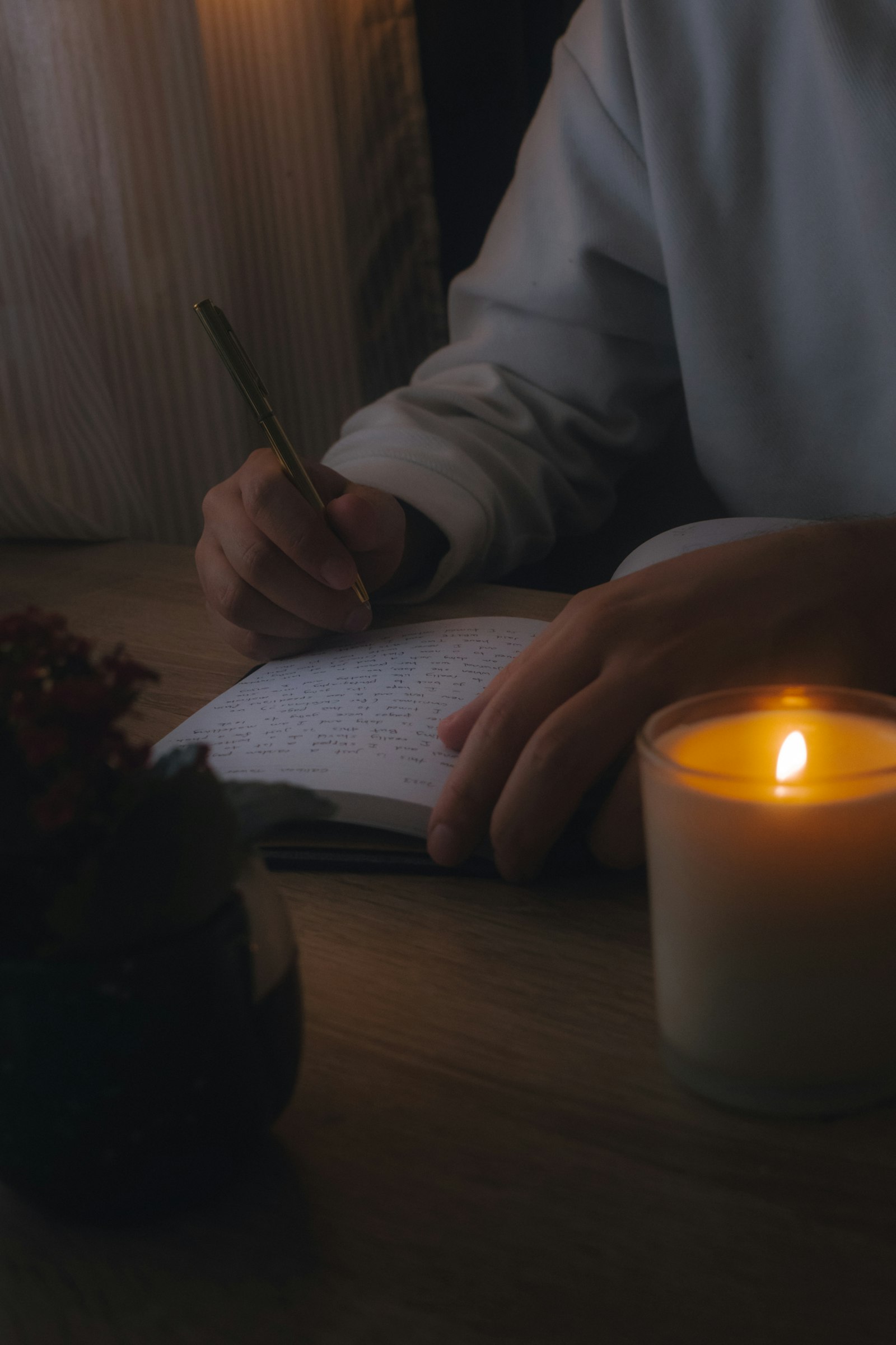 Quiet reflection at a candlelit table